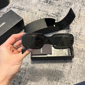 Prada geometric glasses